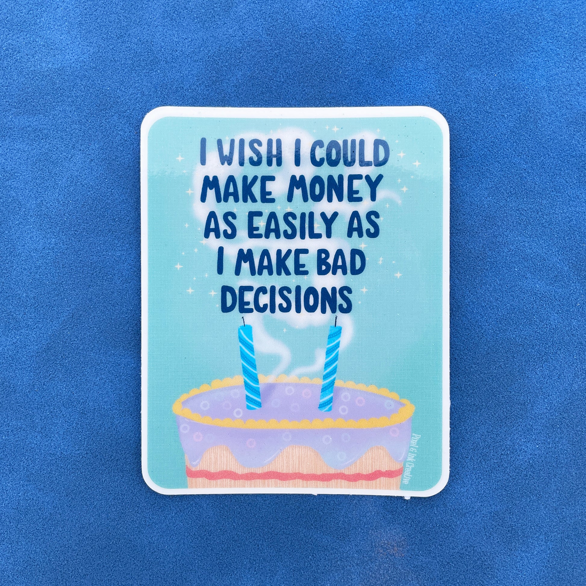 A square sticker with a design that includes a cake with two candles and text above it, set against a blue background.