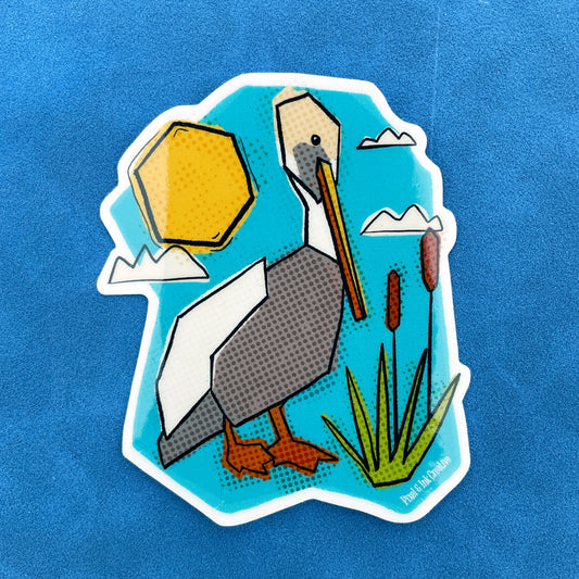 A sticker with an illustration of a pelican, sun, clouds, and grass on a blue background.