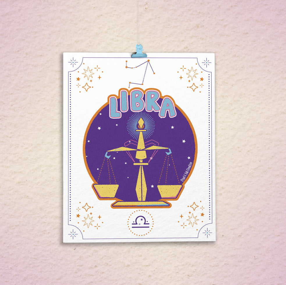 Libra zodiac sign poster with star design on a textured wall.